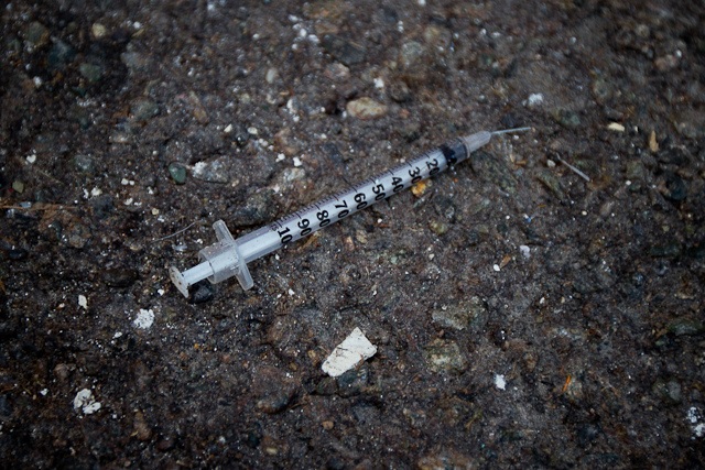 A used syringe found in Chinatown, Vancouver, which depict some of the addiction problems people experiencing homelessness may face. Photograph taken by Laurent Vu (Vu, 2011).