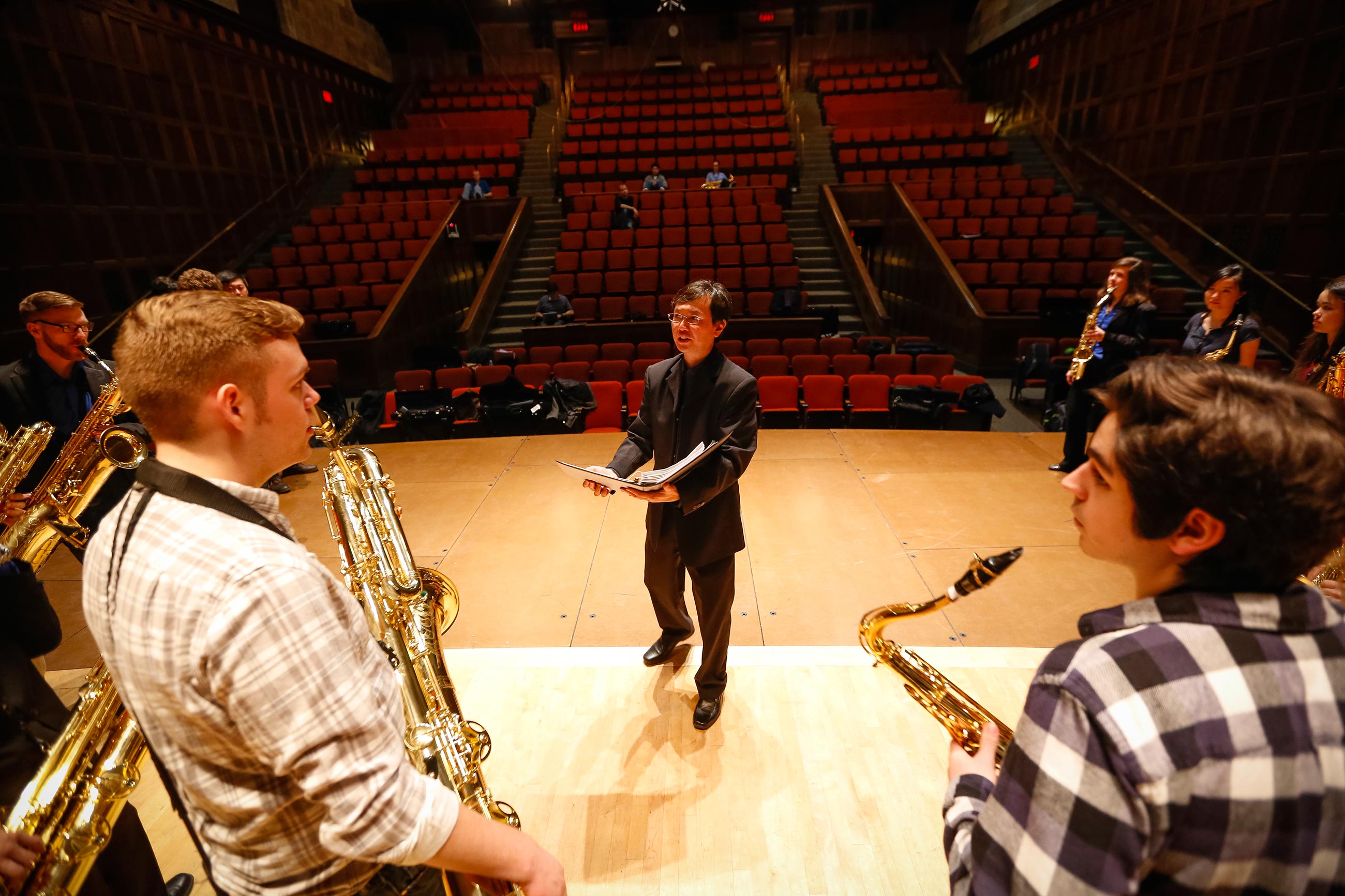 Lin works with his students at a rehearsal of the Eastman Saxophone Project in Kilbourn Hall.