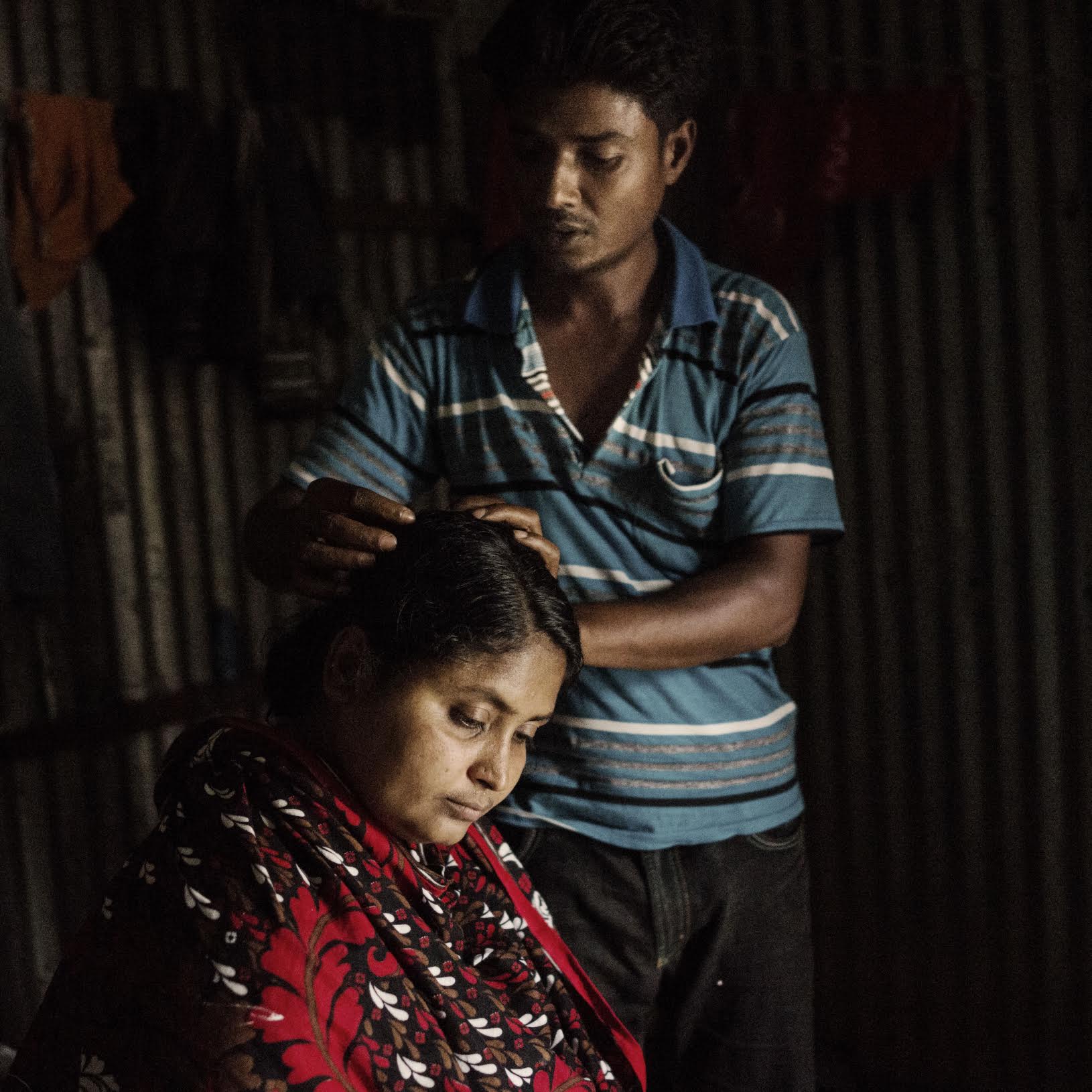 Mominul Islam and his wife Sharvanu. Mominul thought his wife died in the Rana Plaza collapse, only to find out that she was in critical condition at the Dhaka Medical College hospital.
