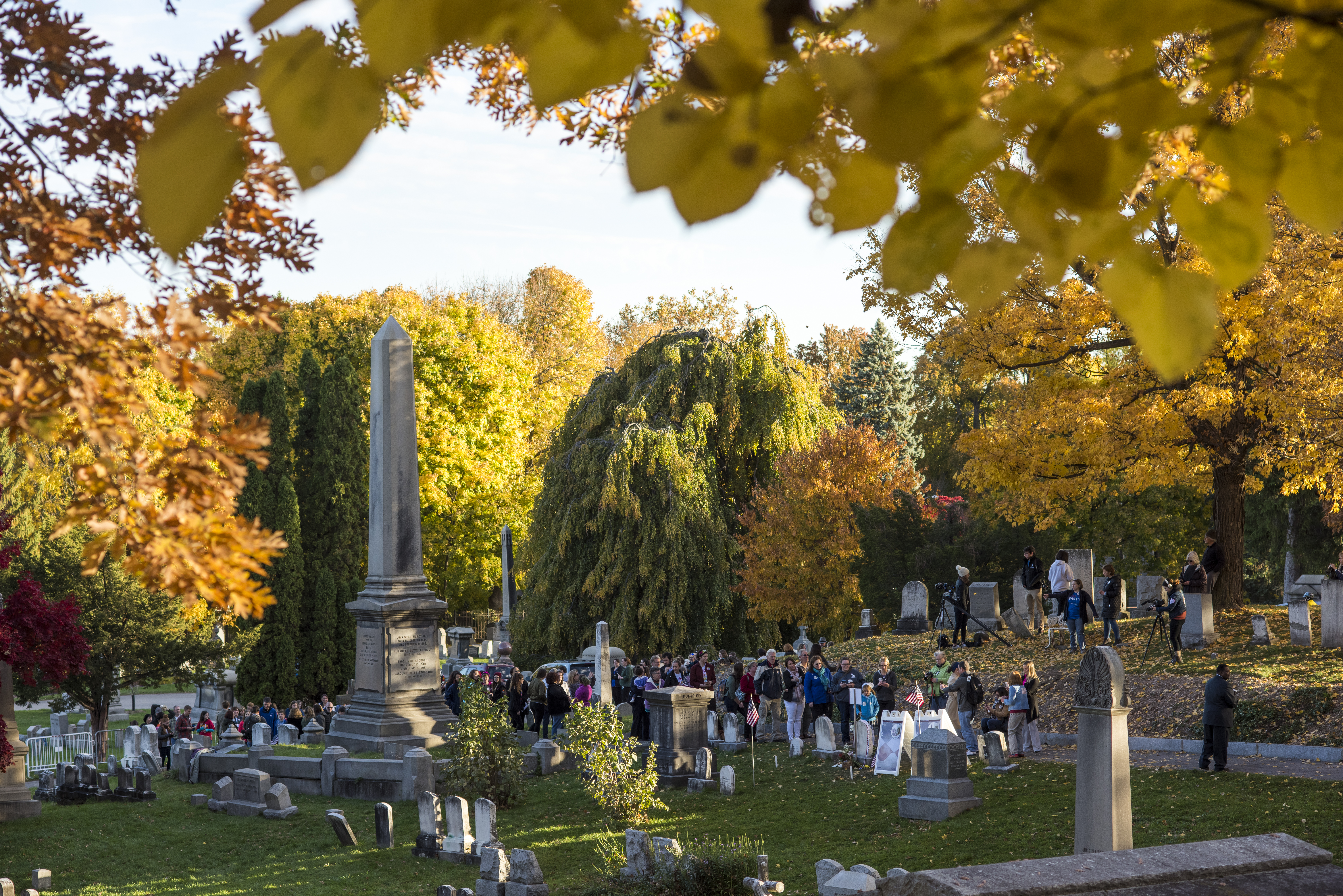 By lunchtime, the line to visit the grave site of Susan B. Anthony stretched across Mt. Hope Cemetery on a beautiful fall day in Rochester. (University photo / J. Adam Fenster)