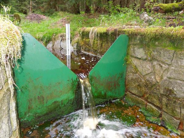V-notch weir.  Notice the staff gauge on the upstream side of the weir used to measure water depth, which is then used to calculate discharge using the appropriate weir equation.  Image from: https://data.lter-europe.net/deims/site/lter_eu_cz_016, last accessed 5/26/18.