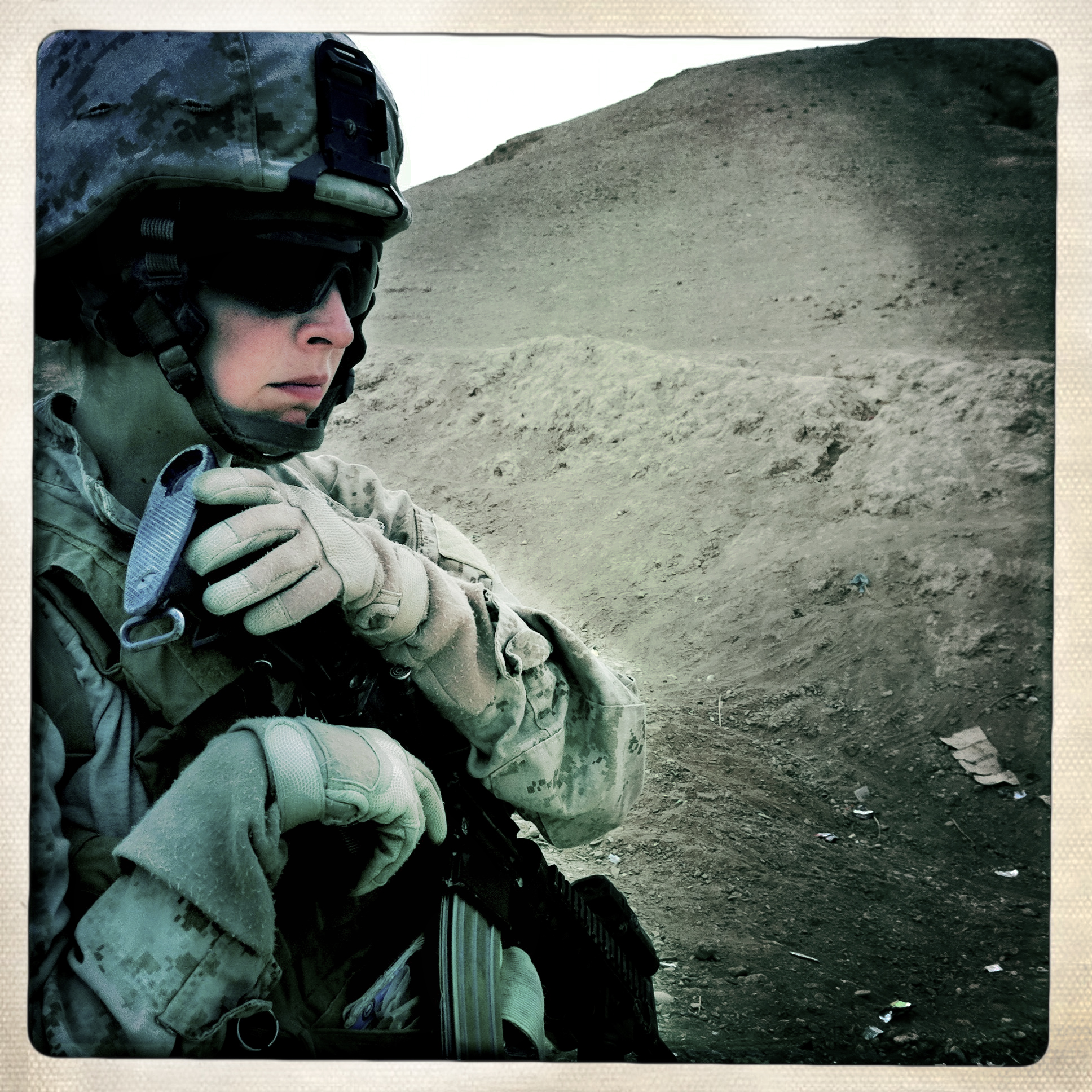 Female Engagement Team member and hospital corpsman Shannon Crowley, 22, of Swampscott, MA on patrol. Attached to 1st Battalion 8th Marines Bravo Company 3rd Platoon. Credit: Rita Leistner, Basetrack, Courtesy of Stephen Bulger Gallery, Afghanistan, 2011.