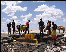 Men struggle to draw water from a drying well in Rabdore, Somalia, where rival clans fought a two-year war over the water supply. (By Emily Wax -- The Washington Post) from: http://www.washingtonpost.com/wp-dyn/content/article/2006/04/13/AR2006041302116.html