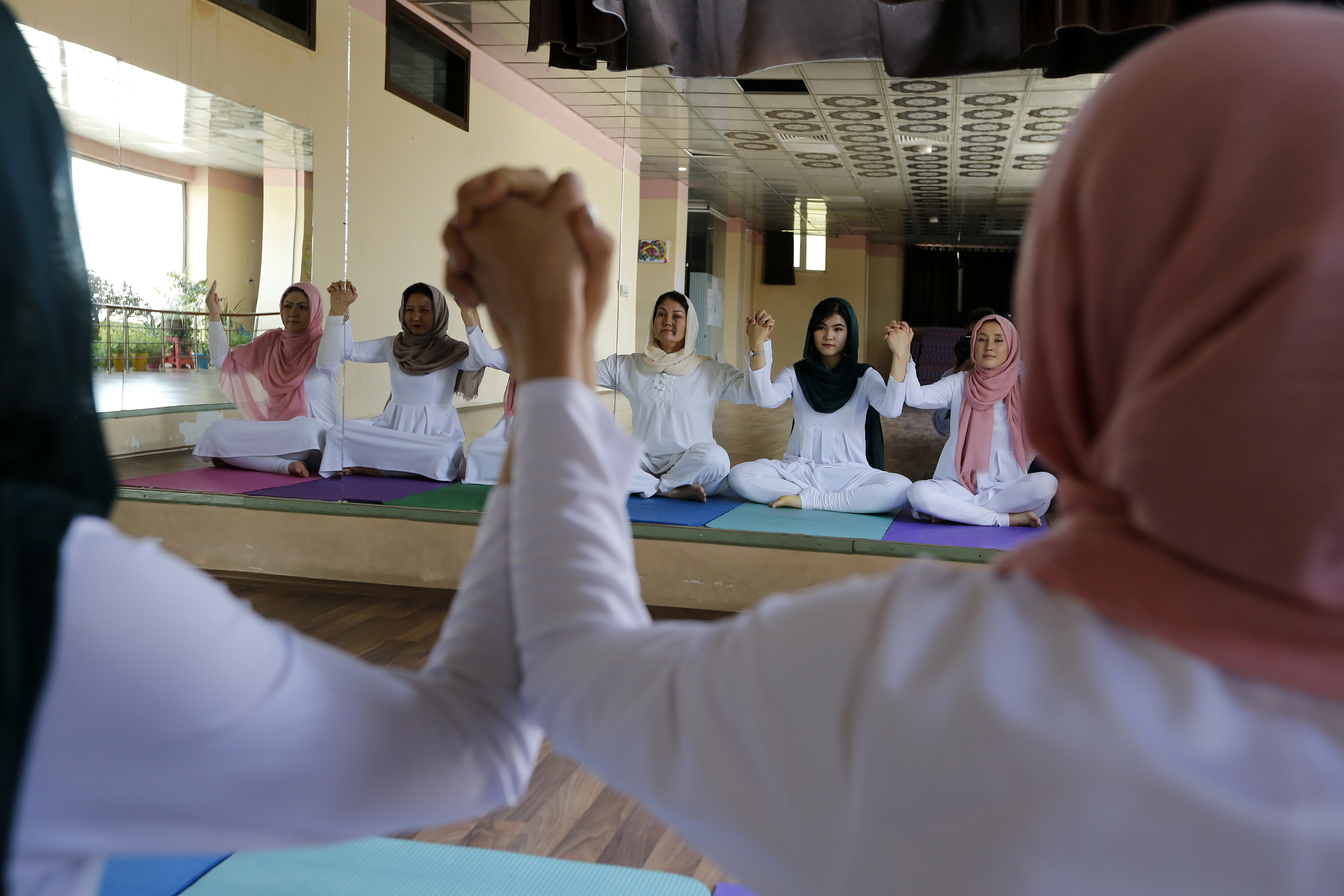 Yoga class at Kabul's first Yoga studio. Opened in 2017, the center helps women build mental and physical strength. UNAMA Photo/Fardin Waezi